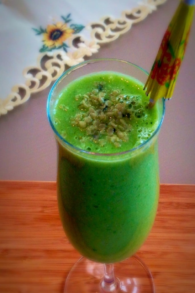 A close up view of cucumber kale ginger smoothie in a serving glass