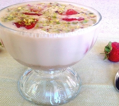 a front view of amaranth soup with roasted strawberries