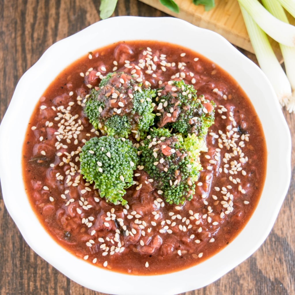 A close up view of broccoli in strawberry sauce