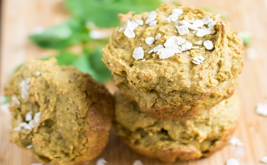 A stack of Savory Kale Oatmeal Cups on a wooden board