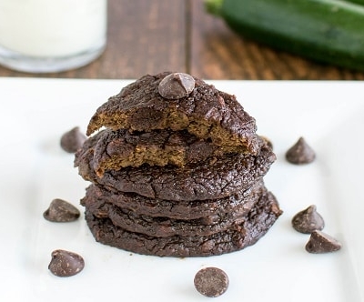 A stack of Fourless Chocolate Zucchini Cookies on a white plate