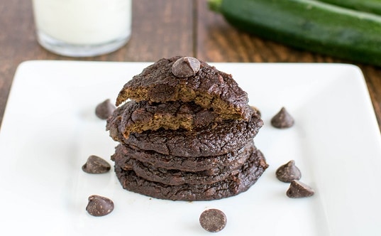 A stack of Fourless Chocolate Zucchini Cookies on a white plate