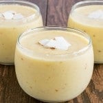 A front view of 3 glasses filled with Pineapple Coconut Tropical Smoothie
