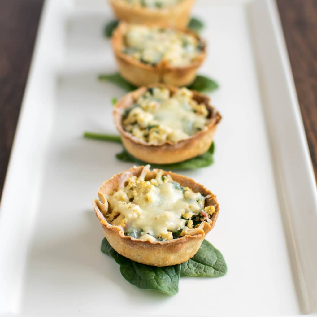 a 45 degree angle view of tofu spinach stuffed crispy cups