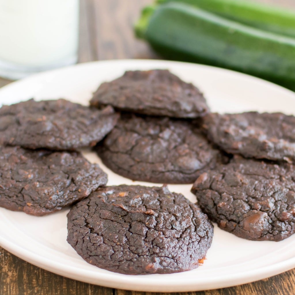 A pink plate with Flourless Chocolate Zucchini Cookies