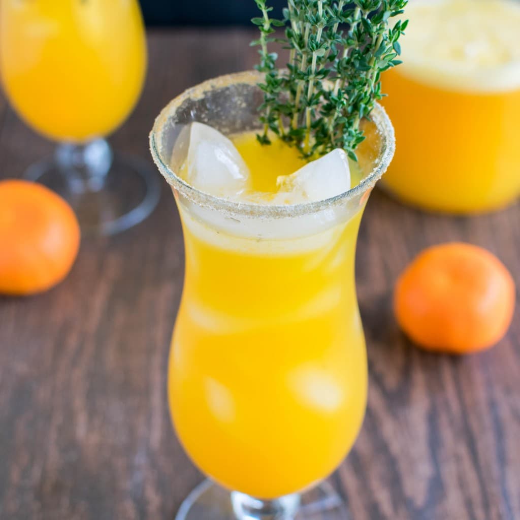 A 45 degree angle view of Orange Thyme Mocktail