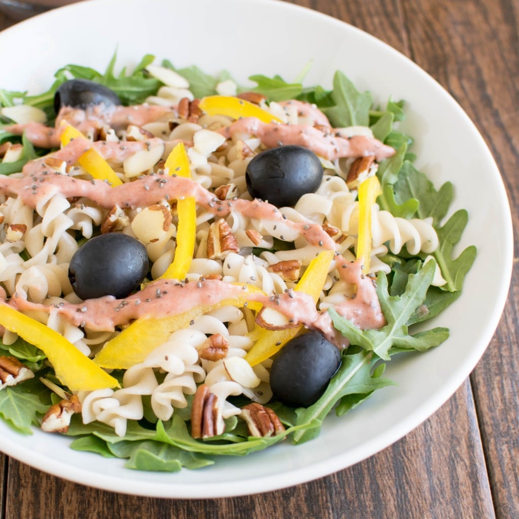 A 45 degree angle view of Arugula Pasta Rhubarb Chia Salad