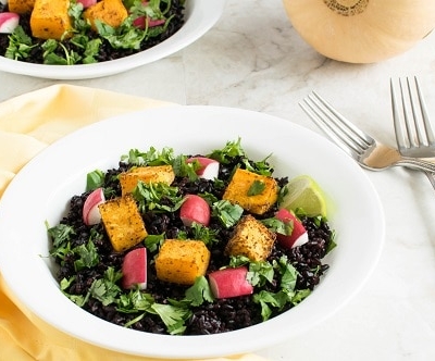 A 45 degree angle view of Cajun Butternut Squash Black Rice Salad
