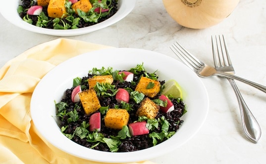 A 45 degree angle view of Cajun Butternut Squash Black Rice Salad