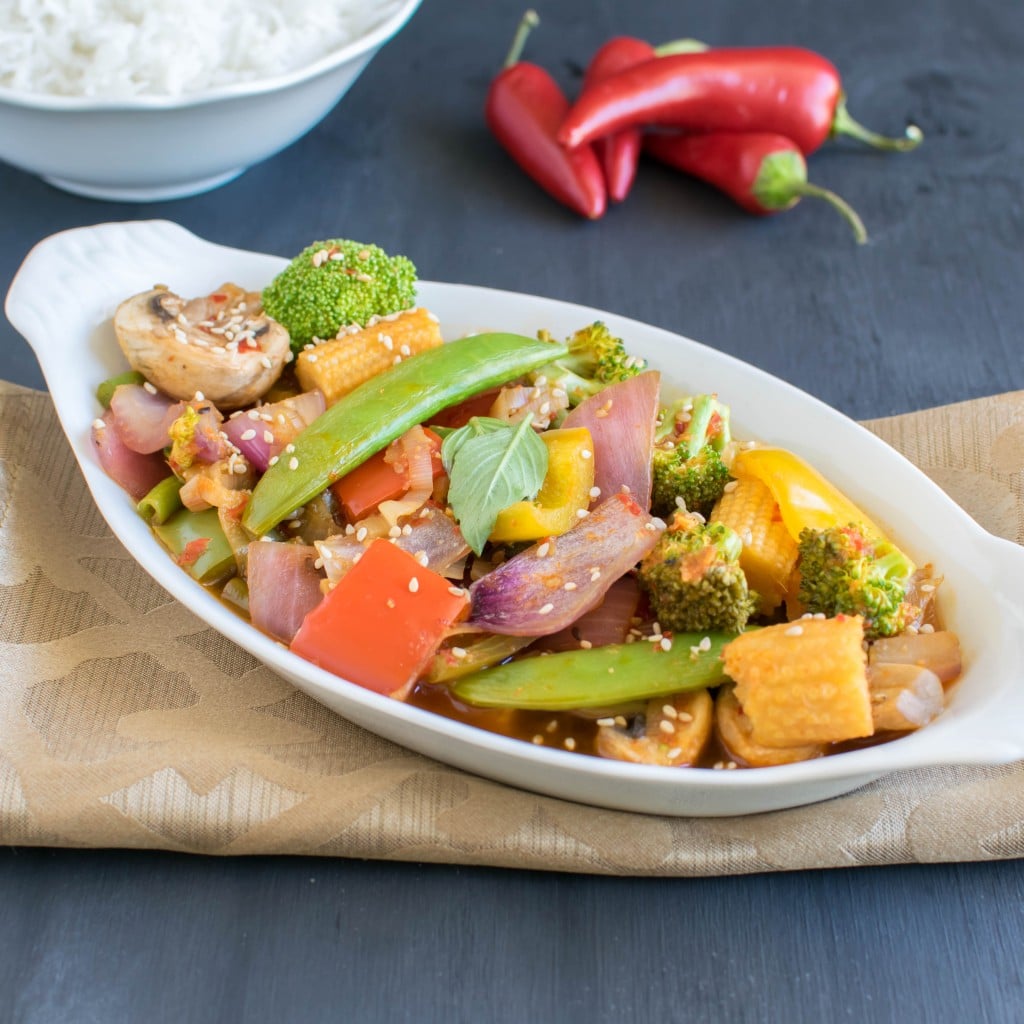 a 45 degree angle view of vegetables in chili garlic sauce.