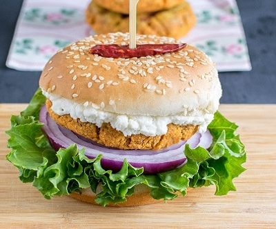 A front view of loaded Lentil Curry Burger