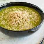 A front view of a bowl filled with Cajun Spiced Barley Kale Soup