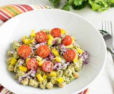 a close up view of chickpeas salad in cilantro dip