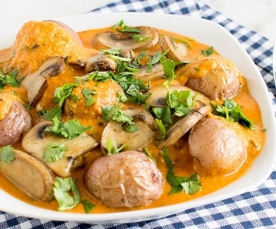 A front view of Red Potato Mushroom Curry in a serving bowl