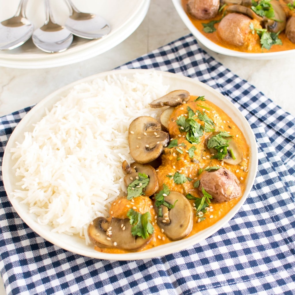 A 45 degree angle view of Red Potato Mushroom Curry