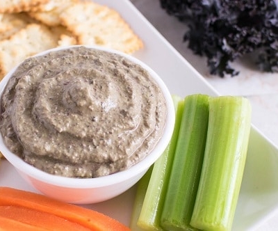 A close up view of cheesy purple kale dip