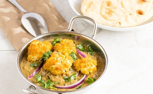 a 45 degree angle view of roasted cauliflower curry