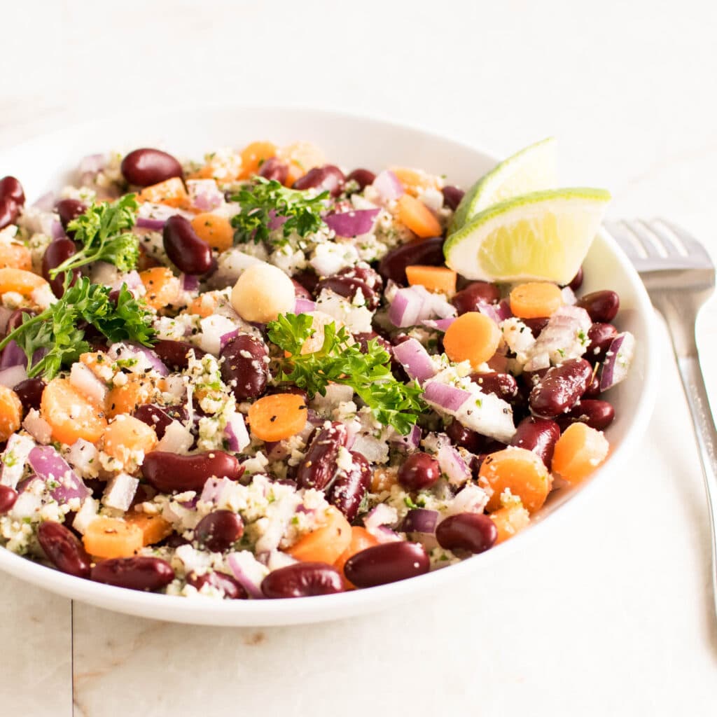 A 45 degree angle view of Kidney Beans Salad with Parsley Macadamia Dressing