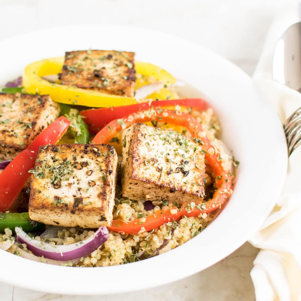 Red Wine Vinegar Tofu with Quinoa is shown plated in this image | kiipfit.com