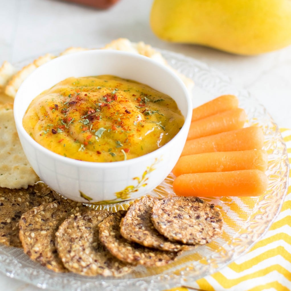 Sriracha Mango Dip with it sides on a plate.