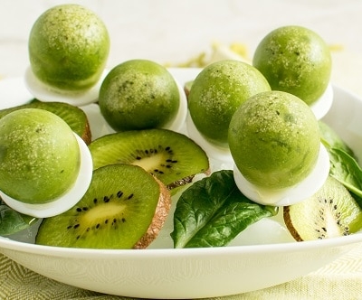 A bowl full of Spinach Kiwi Popsicles