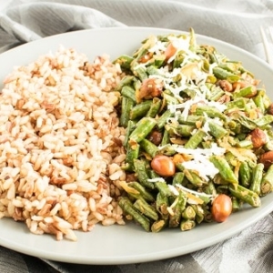 A front view of Coconut Sriracha Long Beans with brown rice