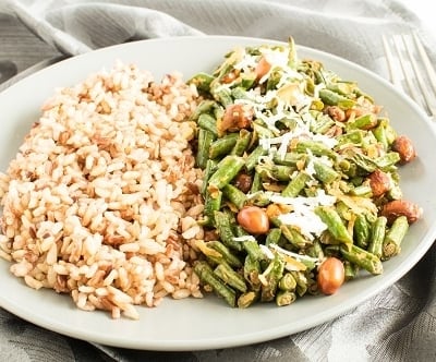 A front view of Coconut Sriracha Long Beans with brown rice