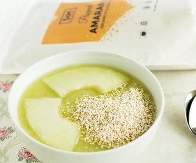 A close up view of popped amaranth honey dew cucumber smoothie bowl