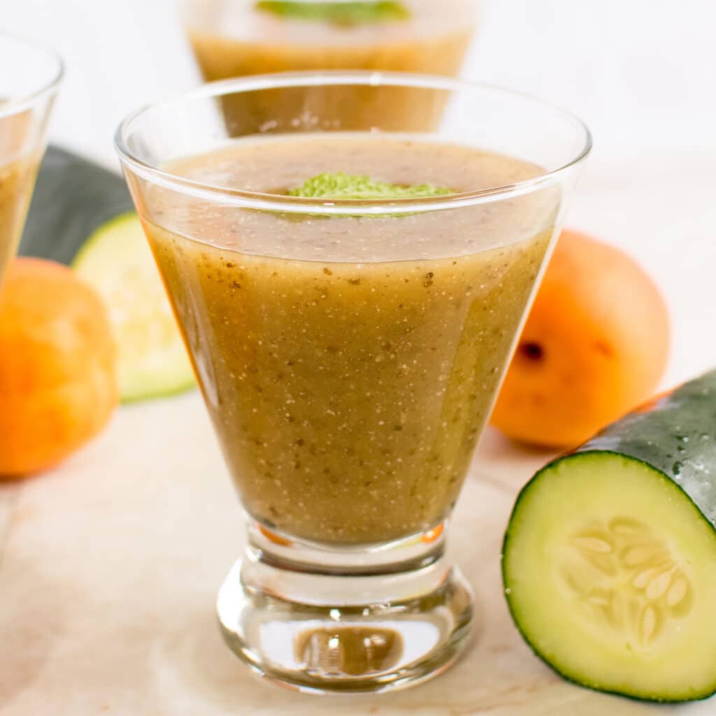 A close view of Apricot Cucumber Chia Smoothie in a glass is shown