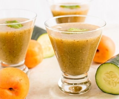 Serving glasses filled with Apricot Cucumber Chia Smoothie is shown