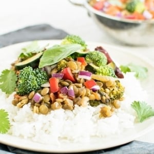 A front view of Basil Vegetable Lentil Curry on steamed rice
