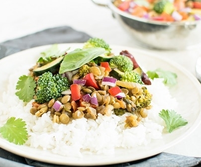 A front view of Basil Vegetable Lentil Curry on steamed rice