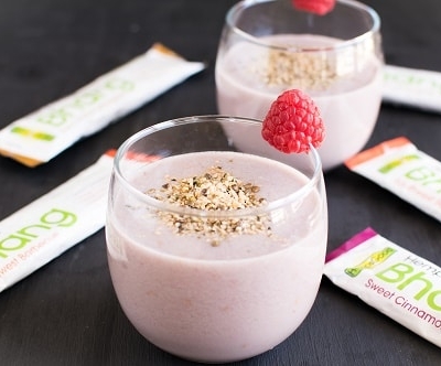 A 45 degree angle of Quick Raspberry Hemp Snack Smoothie is shown in the serving glasses