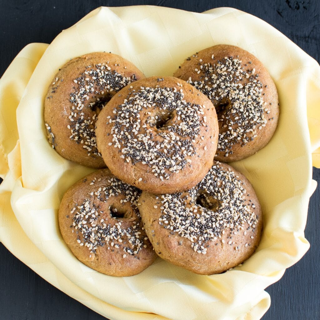top view of butternut squash amaranth bagels in a basket.