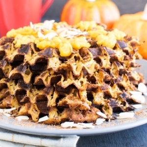 a front view of stacked paleo pumpkin almond waffles