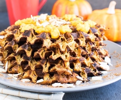 a front view of stacked paleo pumpkin almond waffles