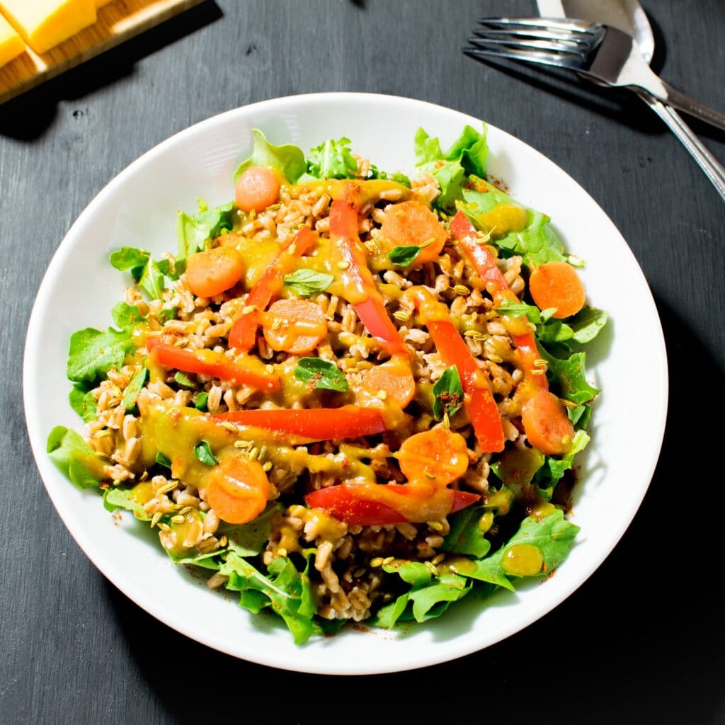 top view of farro salad in butternut squash dressing