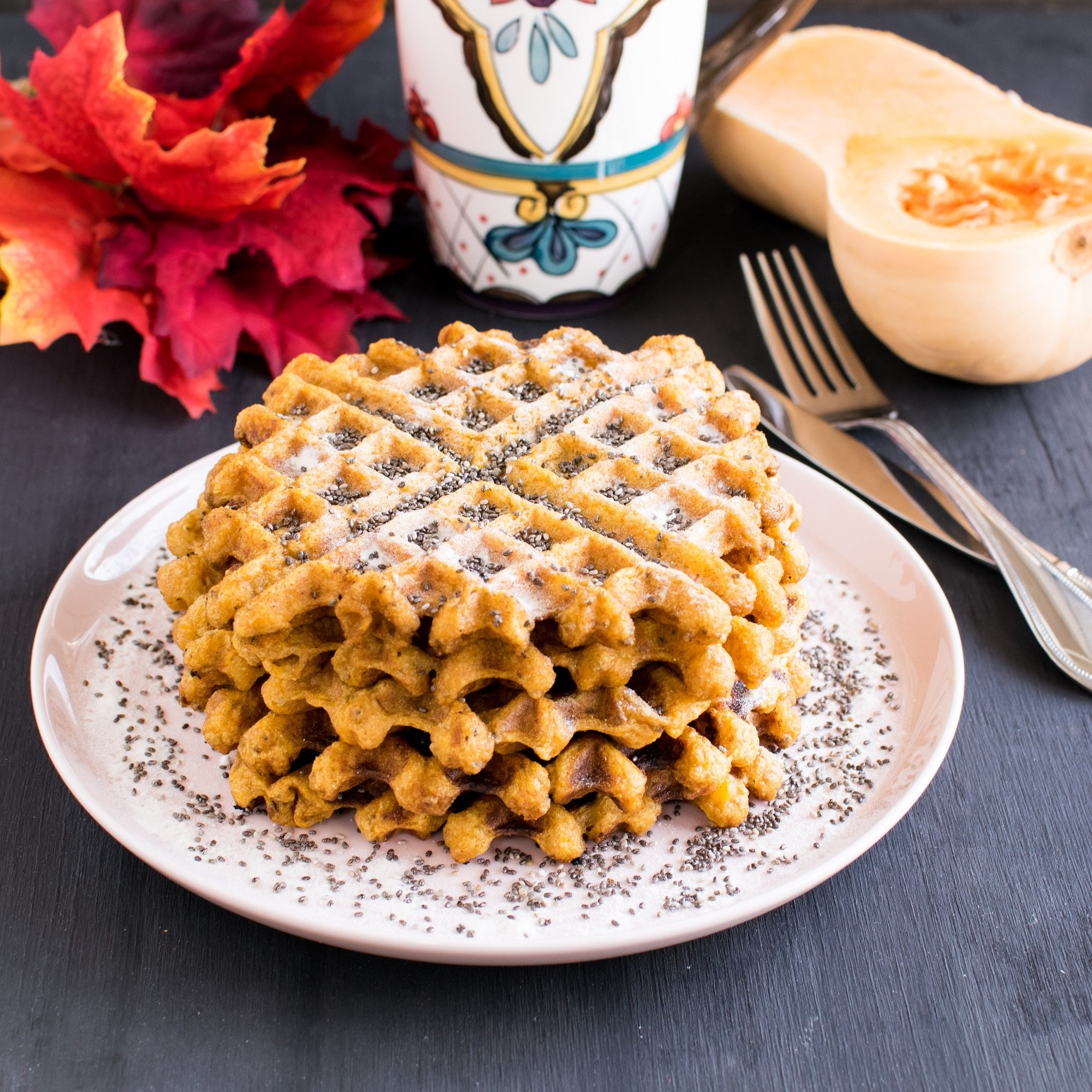 A front view of stacked Butternut Squash Chia Spelt Waffles 