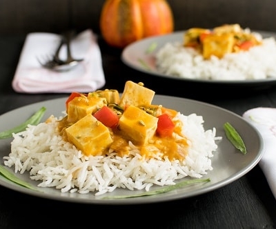A front view of plated tofu pumpkin curry