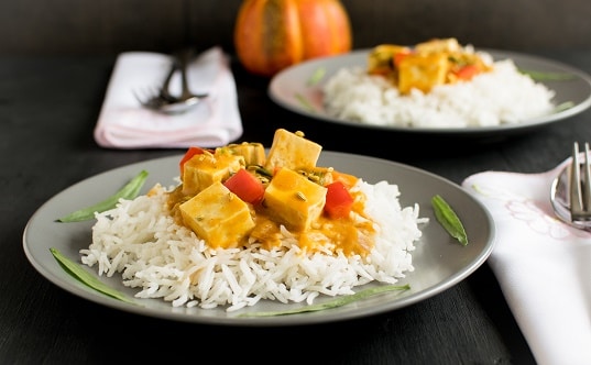A front view of plated tofu pumpkin curry