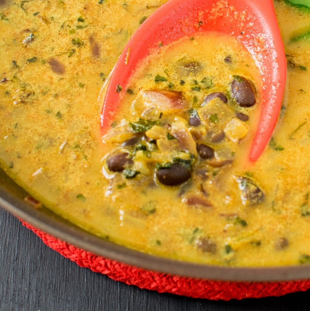 cooked black beans curry in the nonstick pan. 