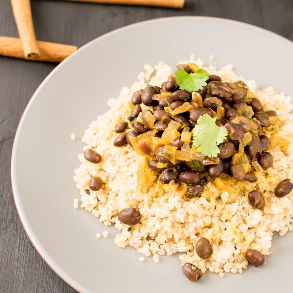 a 45 degree angle view of served black beans curry.