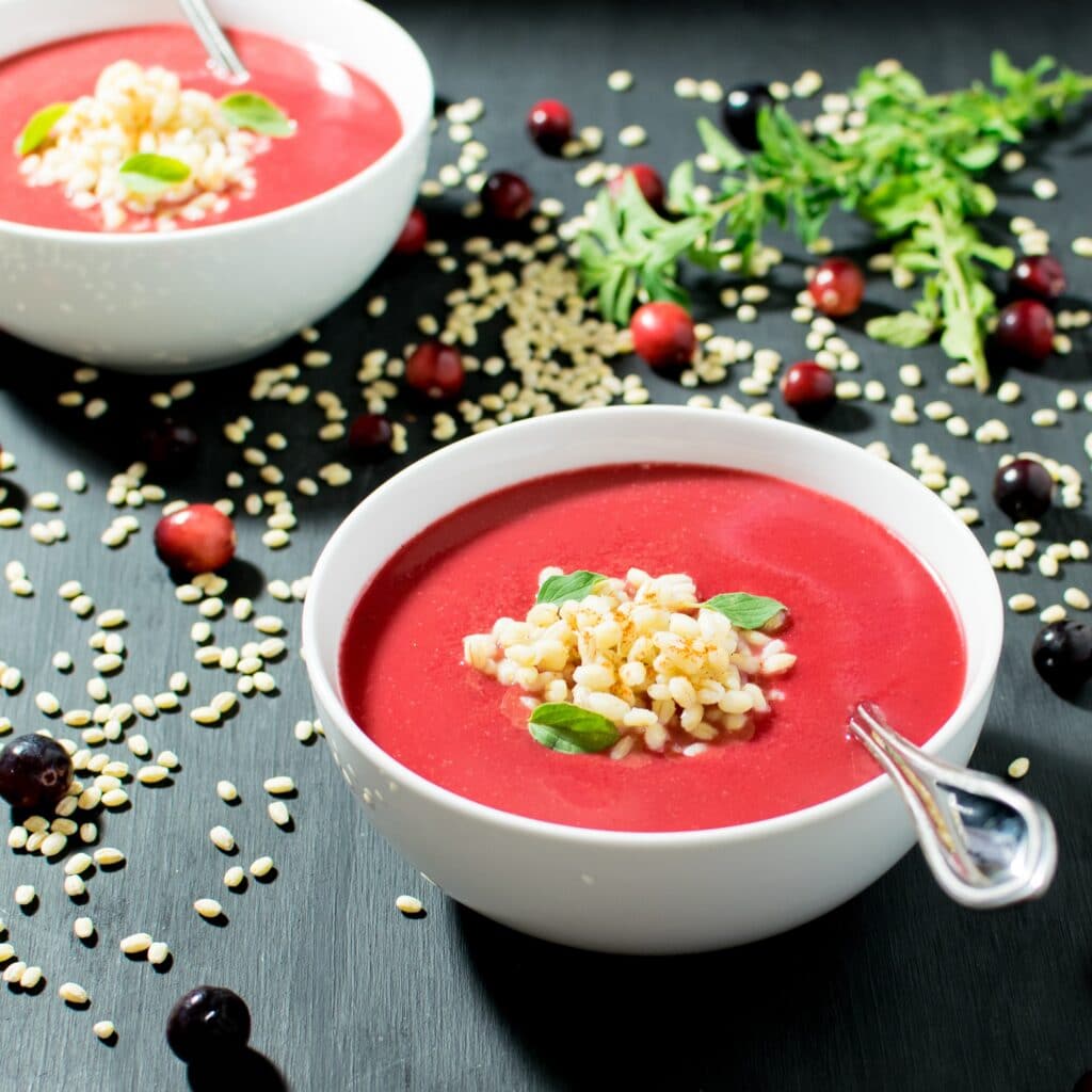 cranberry barley soup in serving bowls.