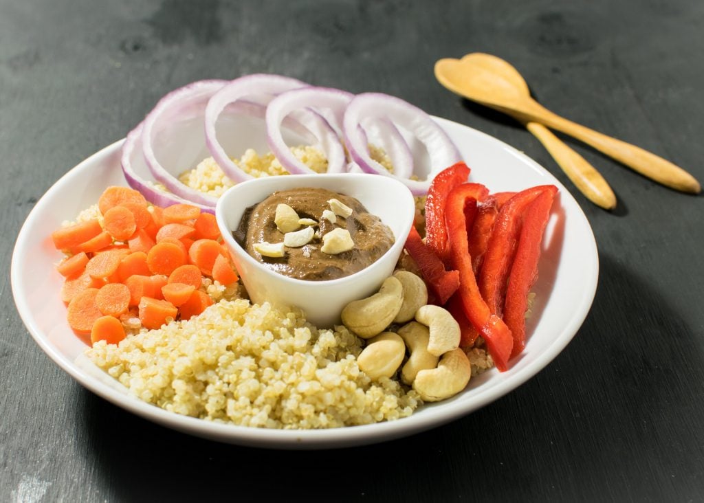 a bowl with the ingredients including the dressing.