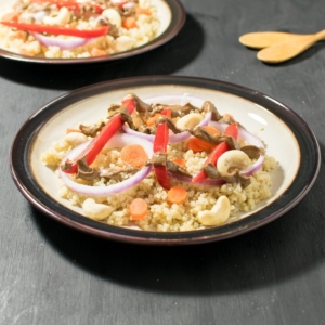 a front view of plated cashew balsamic quinoa salad