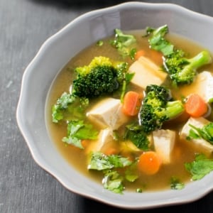 A close up view of cilantro tofu soup in a serving bowl