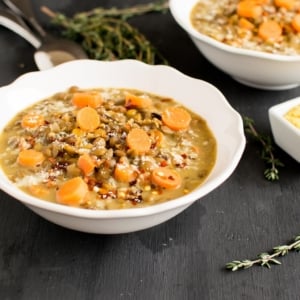 A 45 degree angle view of vegan lentil cheese soup