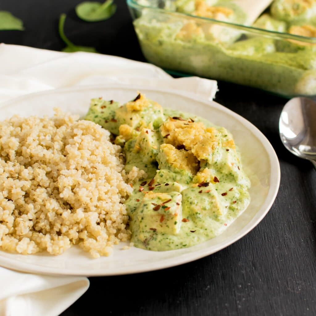 Cheesy Spinach Tofu Casserole with quinoa on a serving plate