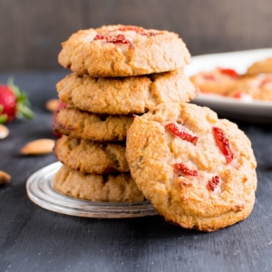 A big stack of Strawberry Yogurt Vegan Cookies with cookies on the side with a focus