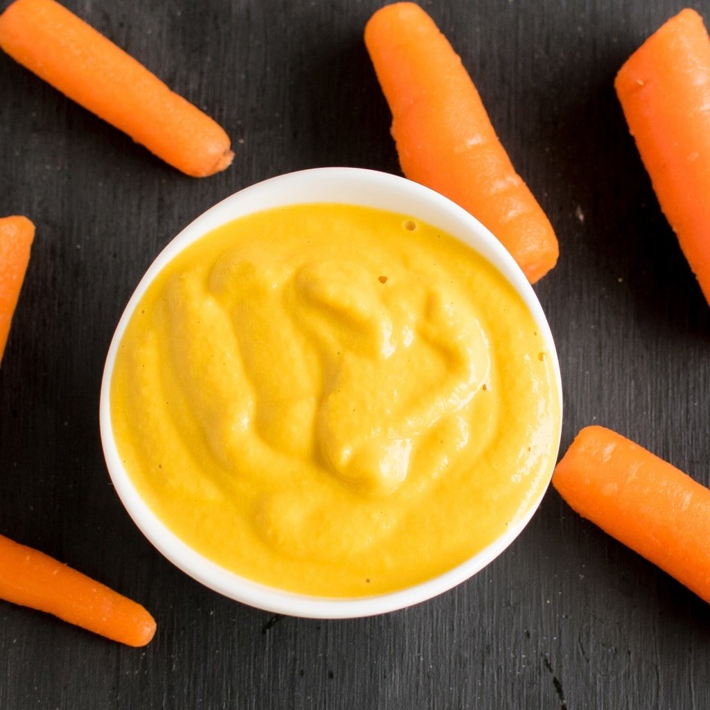 Carrot frosting in a small bowl